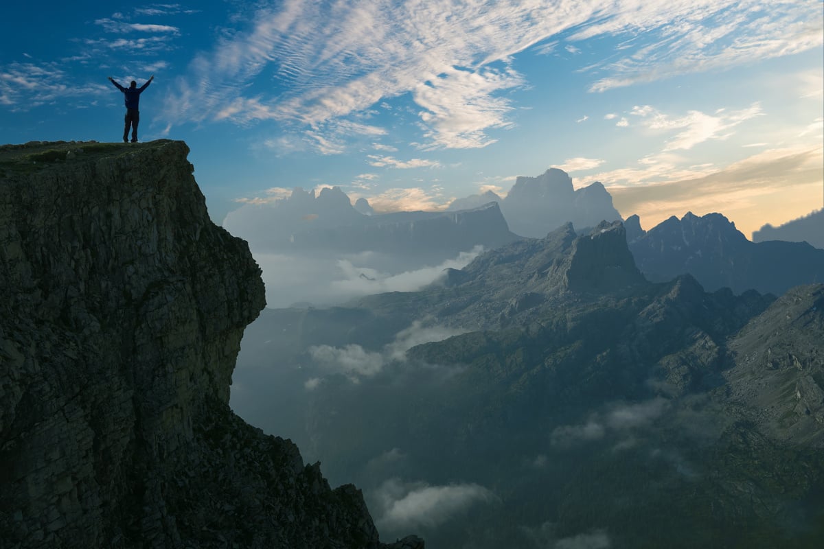 A Man on Top of A Cliff